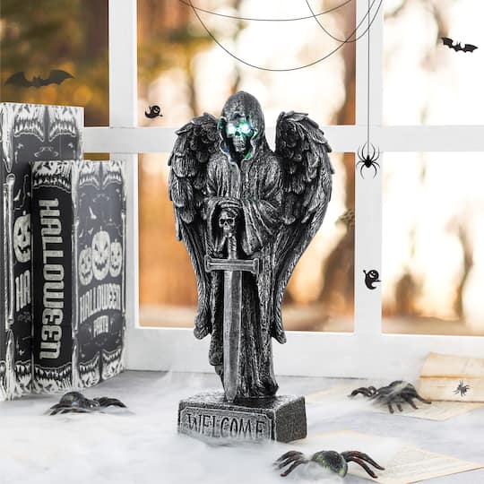 Glitzhome® 12" Halloween Lighted Resin Grim Reaper Table Decor with Timer
